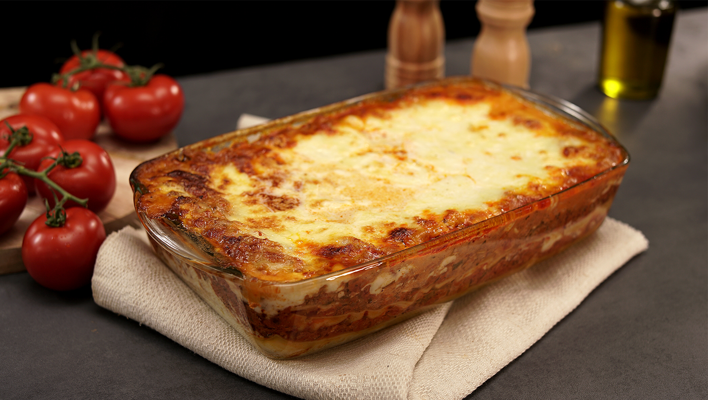Lasagne on a beige cloth.